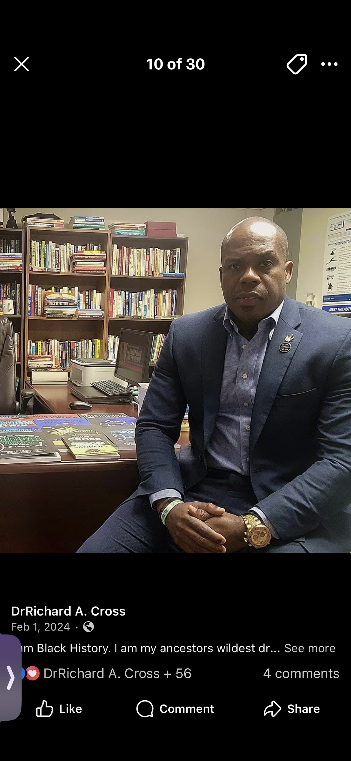 Dr. Richard A. Cross in his office with books